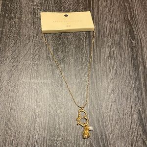 Brock Collection x H&M gold necklace. Pendant with rose and pearl attached.